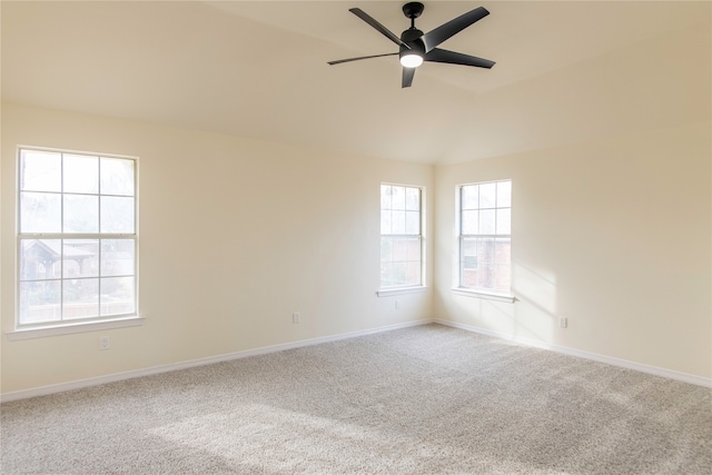 spare room with carpet, ceiling fan, and plenty of natural light