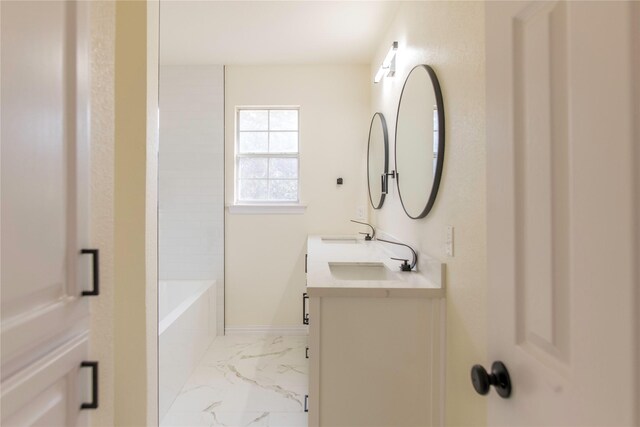 3004 Normandy Dr, Mckinney, TX 75070 - bathroom with marble look tile flooring, double vanity, and baseboards
