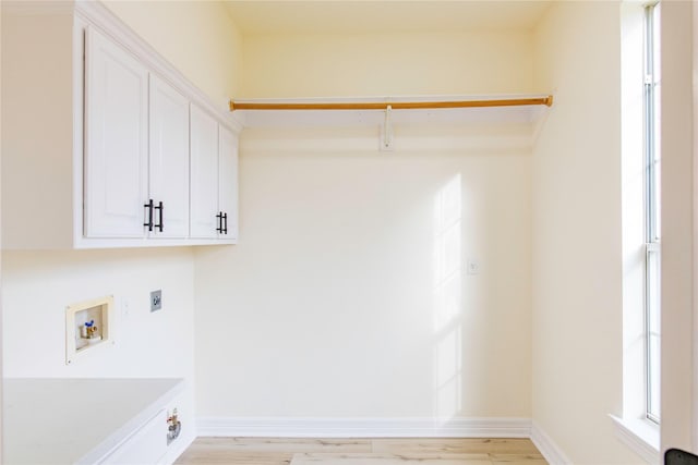 3004 Normandy Dr, Mckinney, TX 75070 - washroom with electric dryer hookup, hookup for a washing machine, light wood finished floors, and cabinet space