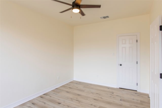 empty room with light wood-type flooring and ceiling fan