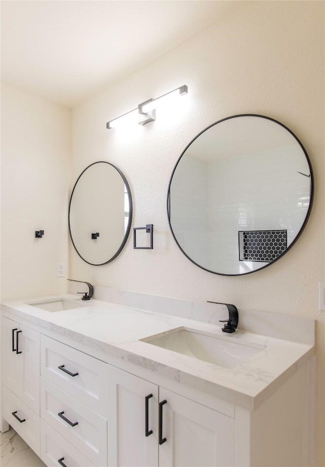 3004 Normandy Dr, Mckinney, TX 75070 - bathroom with double vanity and marble look tiles