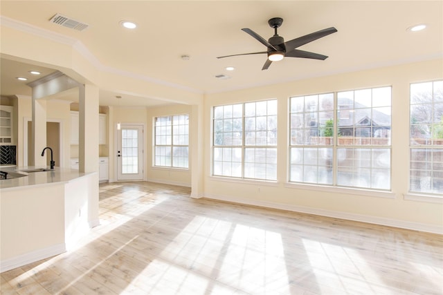 3004 Normandy Dr, Mckinney, TX 75070 - kitchen featuring a sink, ornamental molding, healthy amount of natural light, a ceiling fan, and baseboards