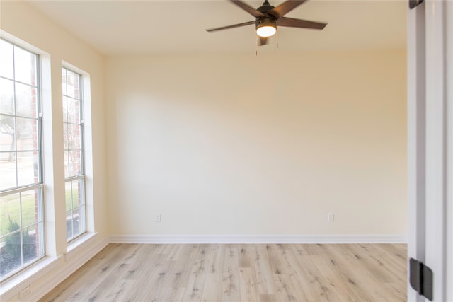 spare room with ceiling fan and light hardwood / wood-style flooring