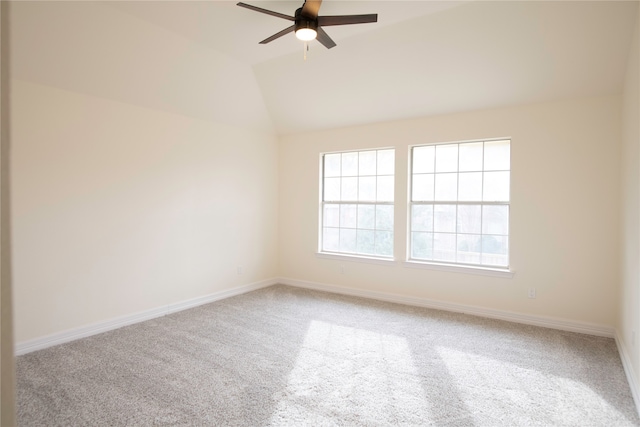 carpeted empty room with lofted ceiling and ceiling fan