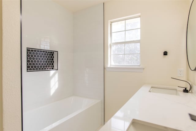 bathroom featuring vanity and washtub / shower combination