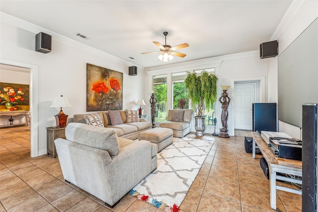 tiled living room with ceiling fan and crown molding