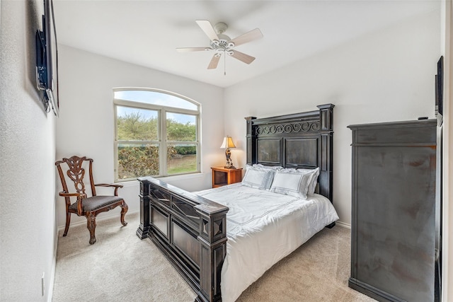 bedroom with ceiling fan and light colored carpet