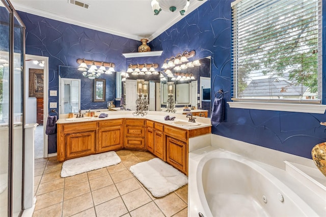 bathroom with tile patterned floors, crown molding, vanity, and a bath