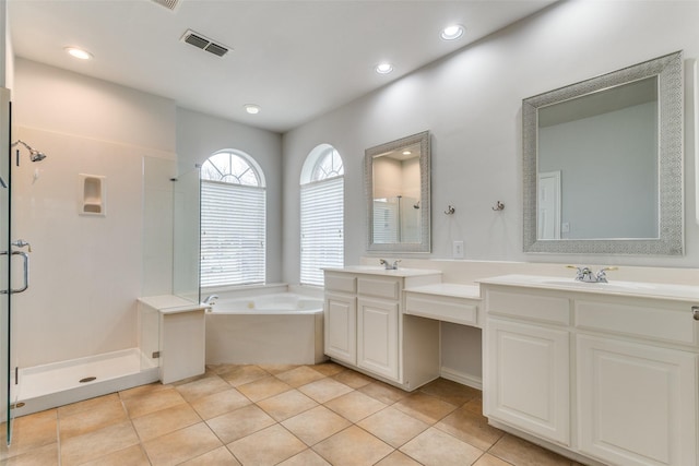 bathroom featuring vanity, plus walk in shower, and tile patterned flooring