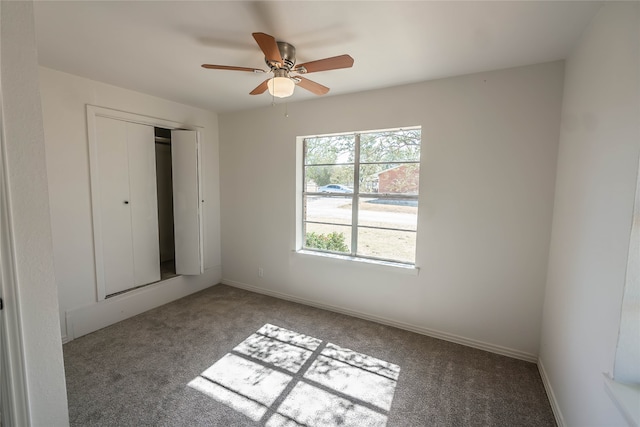 unfurnished bedroom featuring ceiling fan, carpet floors, and a closet