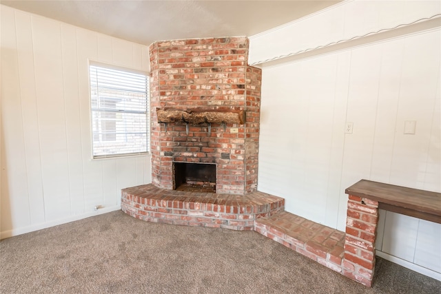 unfurnished living room with a fireplace and carpet floors