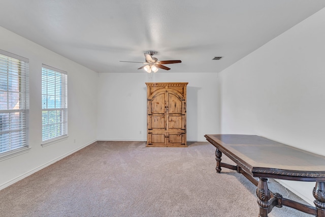 office featuring light colored carpet and ceiling fan