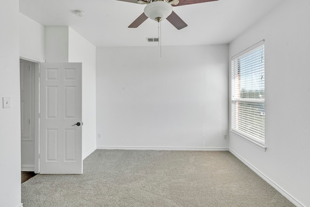 carpeted empty room with ceiling fan