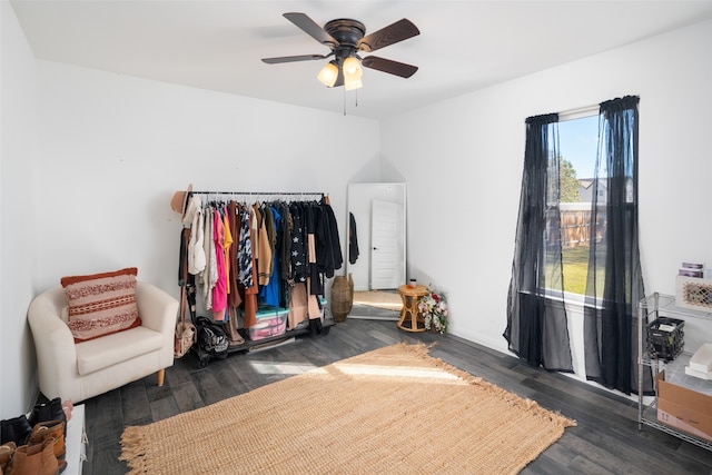 bedroom featuring a ceiling fan and dark wood-type flooring