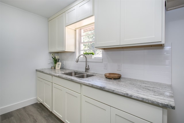 kitchen with white cabinetry, sink, and dark hardwood / wood-style flooring