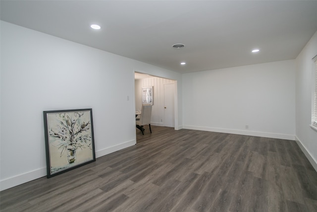 spare room with dark wood-type flooring