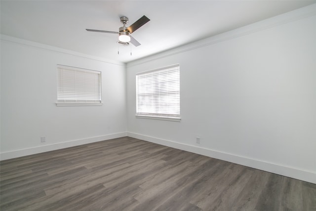 unfurnished room featuring dark wood-type flooring, crown molding, and ceiling fan