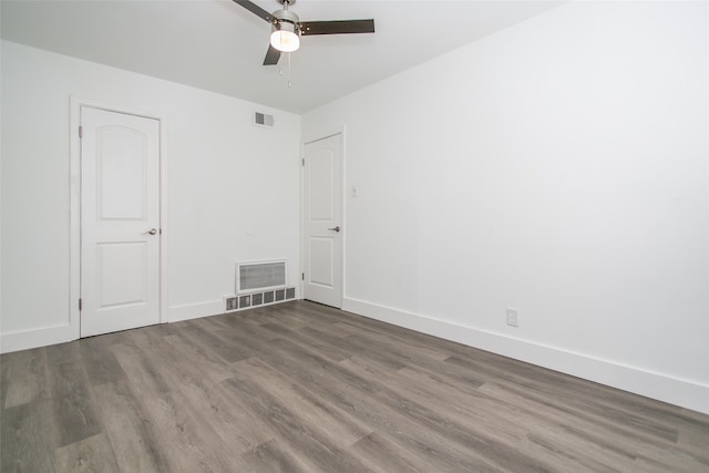 empty room featuring hardwood / wood-style floors and ceiling fan