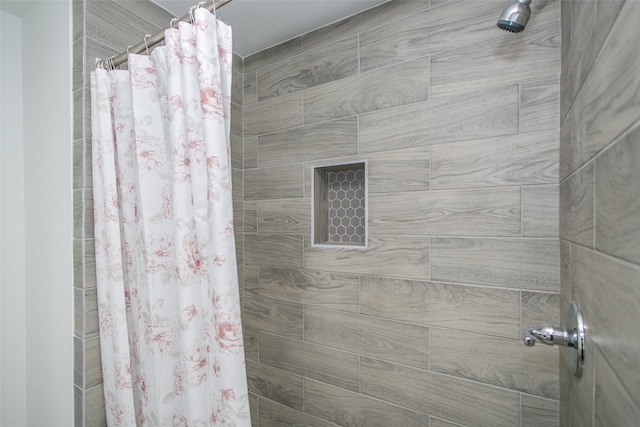 bathroom with a shower with curtain