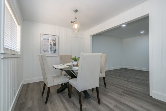 dining area with dark hardwood / wood-style flooring