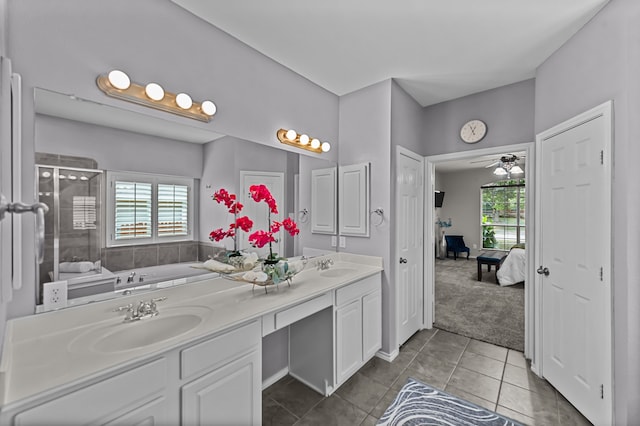 bathroom with tile patterned floors, ceiling fan, vanity, and shower with separate bathtub