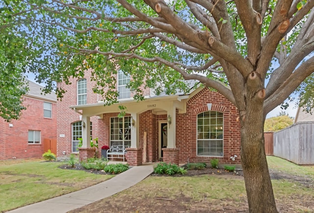 view of front of house with a front lawn and a porch