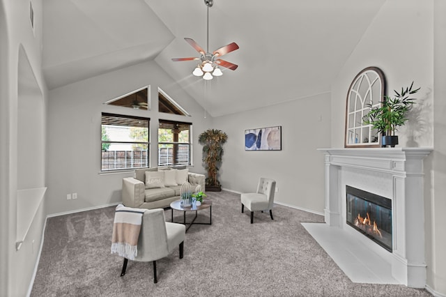 living room featuring ceiling fan, carpet floors, and lofted ceiling