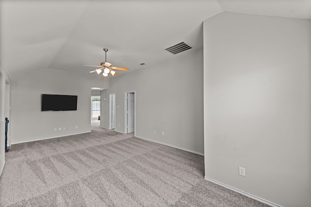 unfurnished living room featuring light carpet, ceiling fan, and vaulted ceiling