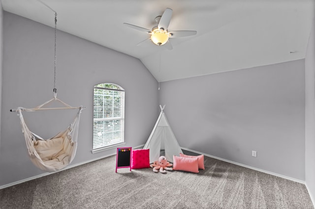 game room with carpet flooring, ceiling fan, and vaulted ceiling