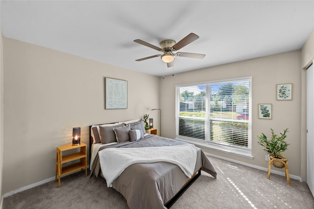 bedroom featuring ceiling fan and carpet flooring