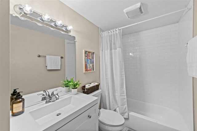 full bathroom featuring vanity, shower / bath combo, and toilet