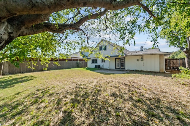 view of yard with a patio and french doors