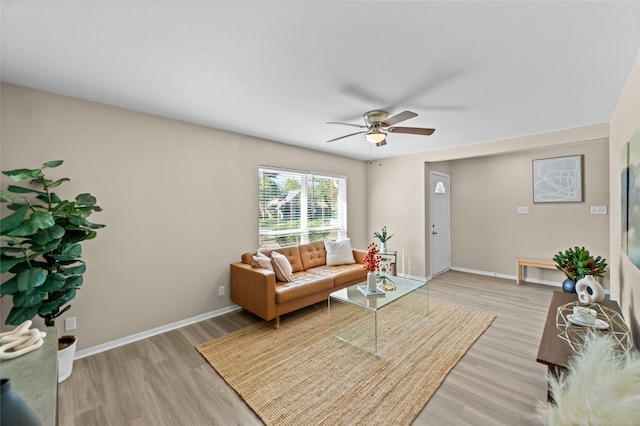 living room featuring light wood-type flooring and ceiling fan