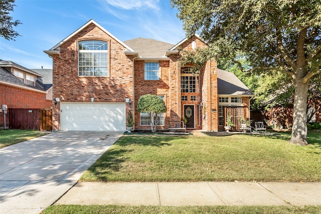 front of property featuring a front yard and a garage