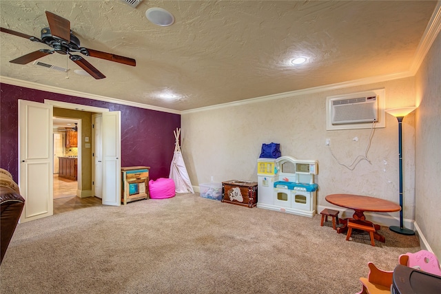 playroom featuring carpet, a wall mounted AC, ornamental molding, and ceiling fan