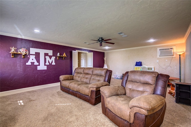 home theater room featuring an AC wall unit, ornamental molding, carpet, a textured ceiling, and ceiling fan