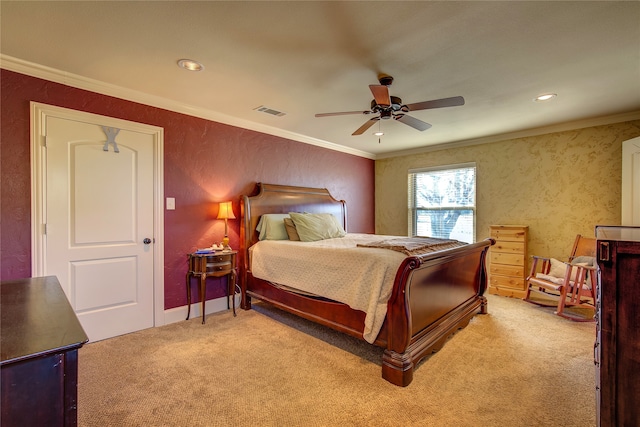 bedroom with ornamental molding, light colored carpet, and ceiling fan