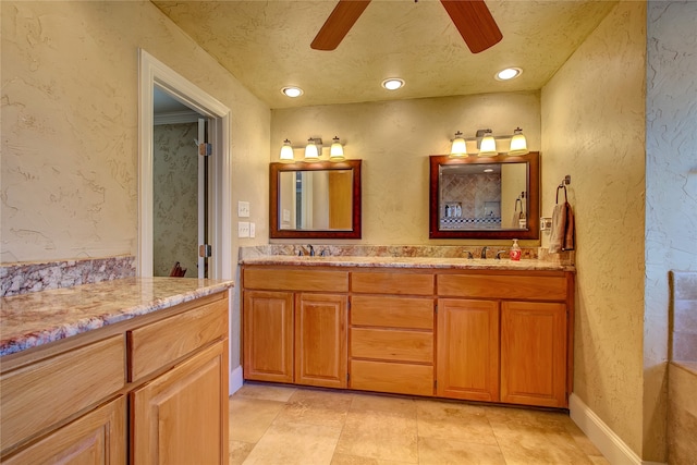 bathroom with vanity, a textured ceiling, tile patterned flooring, and ceiling fan