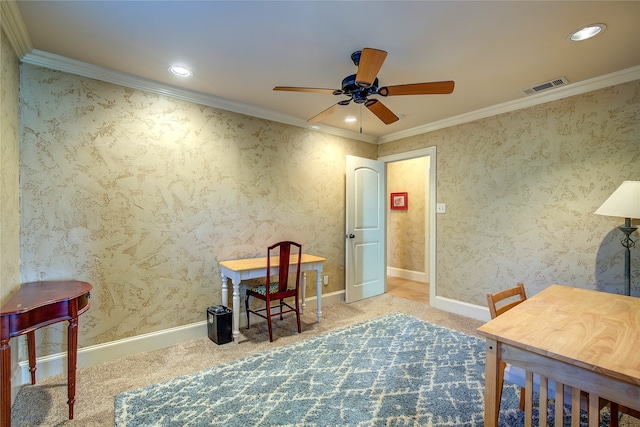 home office with crown molding, carpet, and ceiling fan