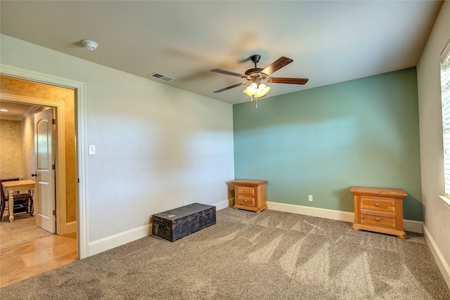 misc room featuring carpet flooring and ceiling fan