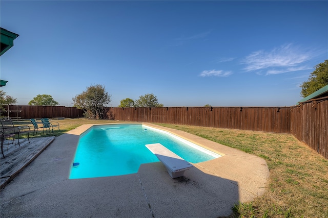 view of pool featuring a patio and a diving board