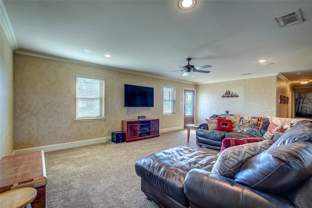 carpeted living room with crown molding and ceiling fan