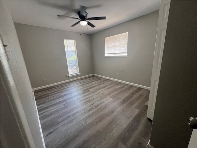 spare room featuring hardwood / wood-style floors and ceiling fan