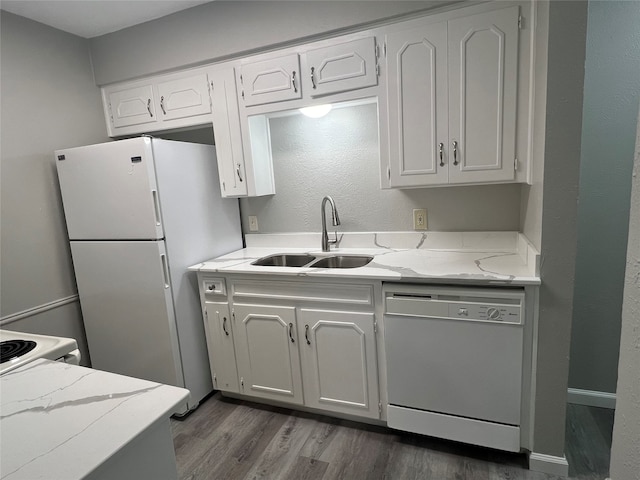 kitchen featuring white cabinetry, sink, dark wood-type flooring, and white appliances