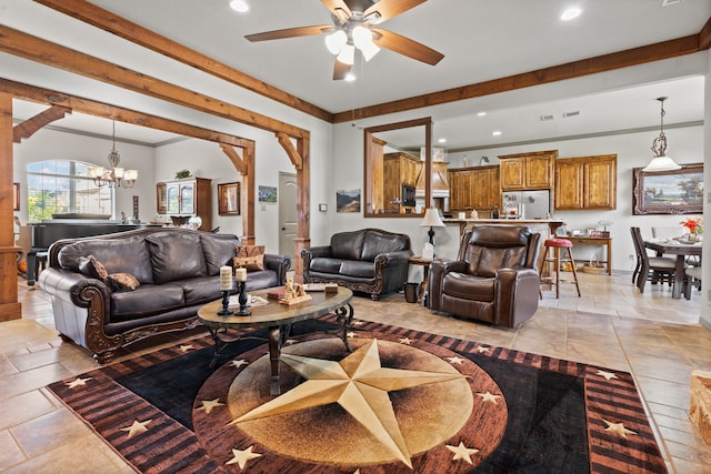 tiled living room with ornamental molding and ceiling fan with notable chandelier