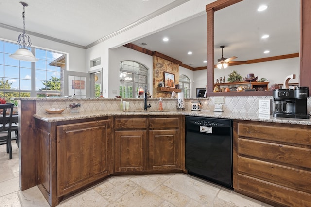 kitchen with sink, light stone countertops, decorative backsplash, and dishwasher