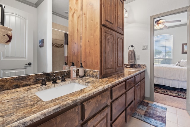 bathroom with tile patterned flooring, ornamental molding, a shower with shower curtain, vanity, and ceiling fan