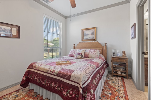 bedroom featuring ceiling fan, ornamental molding, and light colored carpet