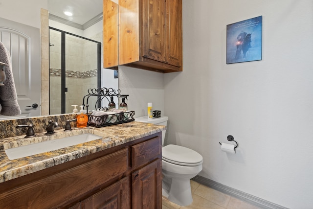 bathroom featuring toilet, ornamental molding, a shower with shower door, vanity, and tile patterned floors