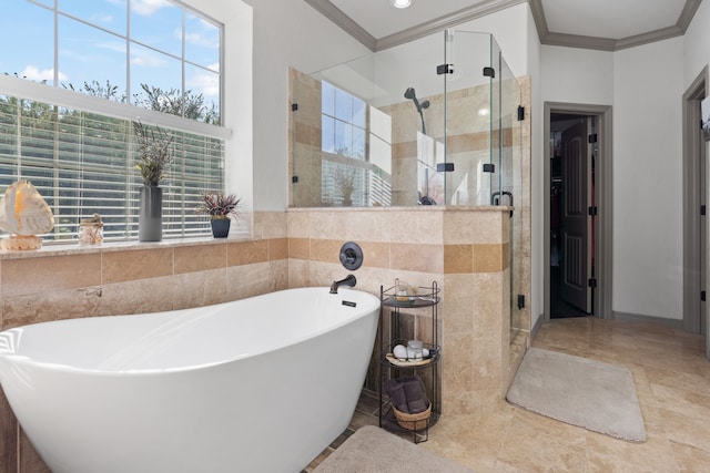 bathroom with tile patterned floors, independent shower and bath, a wealth of natural light, and ornamental molding